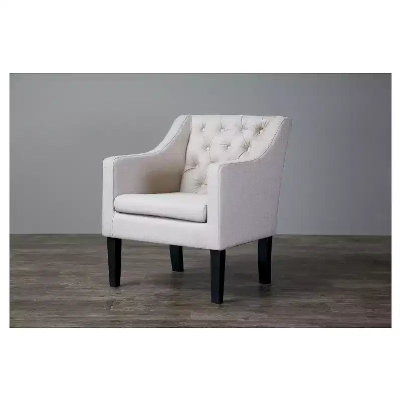 Poltrona club capitonné con rivestimento in lino e gambe in legno placcato nero, portata 113 kg